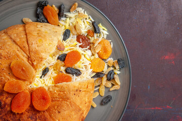 top closer view tasty shakh plov with raisins on dark background cooking rice food meal dough