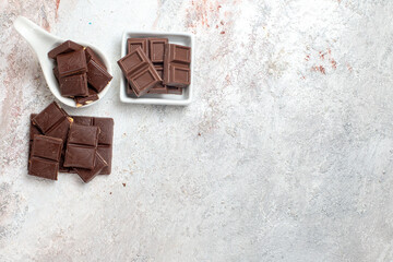 top view chocolate bars on white background tea chocolate drink dessert cocoa