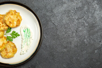 top view cooked squashes slices inside plate on a grey background vegetable meal food dinner squash