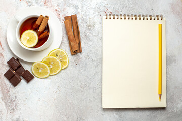 top view cup of tea with lemon slices and chocolate on a white background tea drink fruit lemon