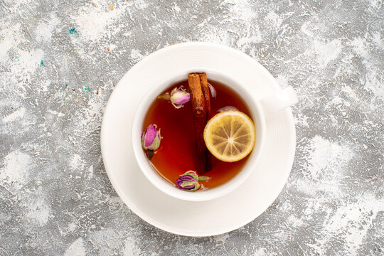 top view cup of tea with lemon on white background tea lemon drink cinnamon
