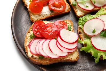 Plate with delicious radish bruschettas isolated on white background