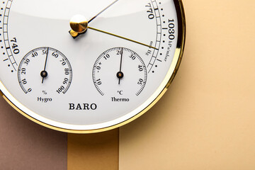 Aneroid barometer on colorful background