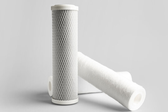 New water filter cartridges on grey background