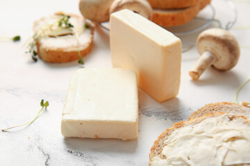 Sandwiches with processed cheese and mushrooms on grunge background