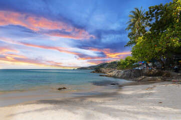 Patong Beach Phuket Thailand nice white sandy beach clear blue and turquoise waters and lovely blue skies with Palms tree sunset sunrise