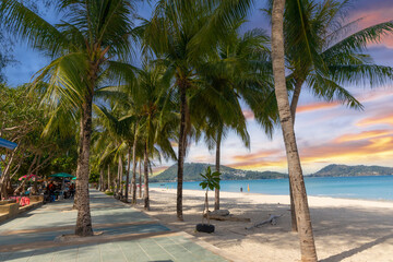 Patong Beach Phuket Thailand nice white sandy beach clear blue and turquoise waters and lovely blue skies with Palms tree sunset sunrise