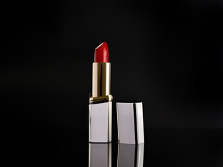 Beautiful red lipstick in black background
