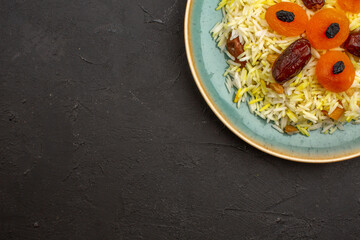 top view delicious cooked plov rice with different raisins inside plate on grey background rice meal dinner raisin food cooking