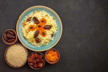 top view delicious cooked plov rice with different raisins inside plate on grey background rice meal dinner food cooking raisin