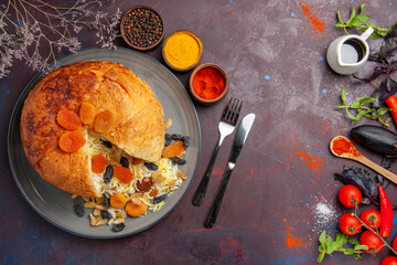 top view delicious shakh plov with raisins and different seasonings on a dark background rice dough...
