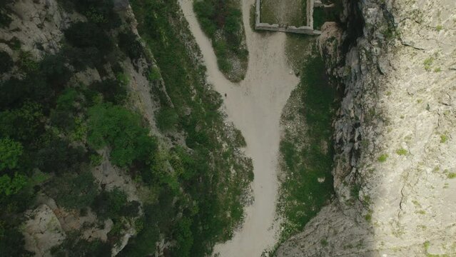 Aerial zenithal of the ruins of an antic monastery, San Martino in Valle, shot with a 4K drone