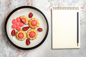 top view delicious sugar cookies with strawberry jelly on the white background jelly fruit cake sugar sweet biscuit