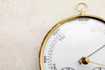 Aneroid barometer on grey grunge background
