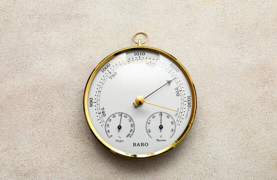 Aneroid barometer on grey grunge background