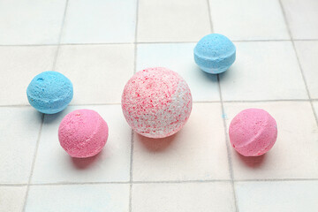 Bath bombs on white tile background
