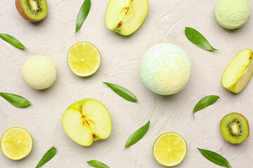 Bath bombs with fruits and leaves on grunge background