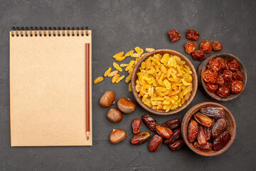 top view different tasty raisins from grape and other fruits on a grey background dry fruit raisin food