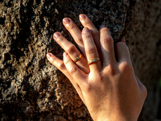 Close up of the hands of a just married couple showing their rings in their wedding day. Romantic symbol of a pair of lovers. good for valentine, romantinc, love concept