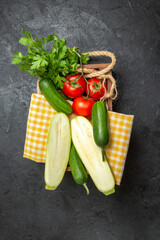 top view fresh vegetables tomatoes cucumbers squashes and greens on grey background meal salad ripe vegetables