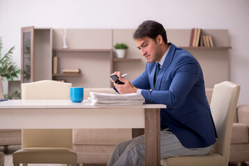 Young male employee working from home during pandemic