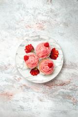 Fototapeta na wymiar top view pink strawberry cakes with fresh red strawberries on a white background fruit cake biscuit sweet tea cookie