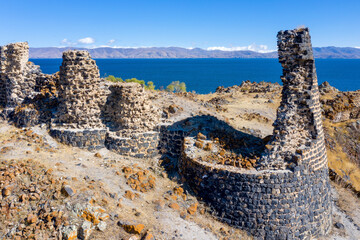 Remains of medieval Berdkunk fortress on sunny summer day. Gegharkunik Province, Armenia.