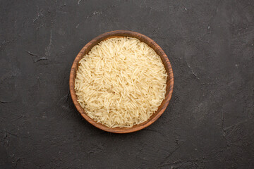 top view raw rice inside brown plate on grey background rice raw meal food east cooking