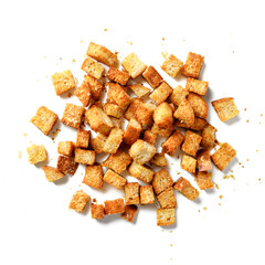 Homemade crunchy croutons flavored with parmesan cheese isolated on white background, top view
