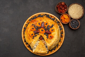 top view shakh plov delicious rice meal cooked inside round dough with raisins on a grey background food rice dinner cooking dough