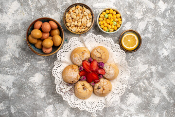 top view sweet candies with nuts and cookies on white background nut snack sweet sugar