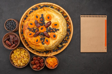 top view tasty shakh plov cooked rice inside round dough with raisins on grey floor dough rice meal cooking cuisine