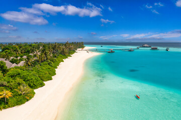 Beautiful Maldives paradise. Tropical aerial travel landscape, seascape with wooden bridge, water villas, amazing sea sand sky beach, tropical island nature. Exotic tourism destination summer vacation