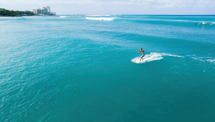 Hawaiian surfer riding a wave