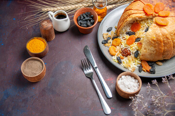 top view tasty shakh plov with raisins and seasonings on a dark background cooking rice food meal...