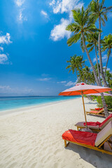 Beautiful amazing beach with umbrellas and lounge chairs beds turquoise sea palm trees, sunny sky. Leisure summer landscape, idyllic inspire couple vacation, romantic holiday. Freedom resort travel