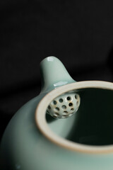 Chinese high-end tea set, porcelain, containers for tea, close-up, indoor dark background