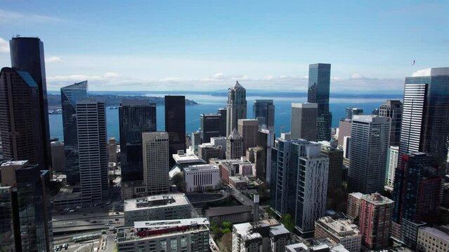 Blue Sky Aerial of Seattle Skyline with Ocean Background