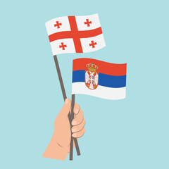 Flags of Georgia and Serbia, Hand Holding flags