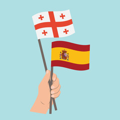 Flags of Georgia and Spain, Hand Holding flags