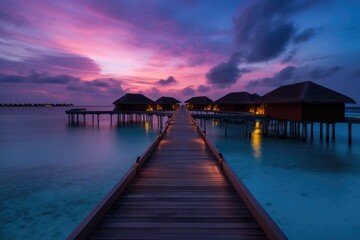 Obraz premium Amazing drone view of the beach and water with beautiful colors. Paradise scenery water villas with amazing sea and beach, tropical nature. summer vacation.