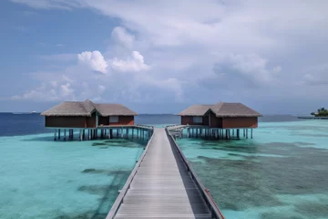 Fotobehang Amazing drone view of the beach and water with beautiful colors. Paradise scenery water villas with amazing sea and beach, tropical nature. summer vacation. © PimPhoto
