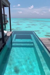 Obraz premium Amazing drone view of the beach and water with beautiful colors. Paradise scenery water villas with amazing sea and beach, tropical nature. summer vacation.