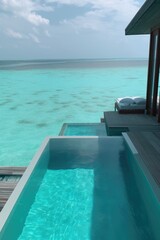 Obraz premium Amazing drone view of the beach and water with beautiful colors. Paradise scenery water villas with amazing sea and beach, tropical nature. summer vacation.