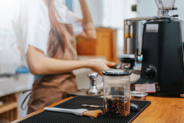Barista hands coffee barista woman make hot cup espresso shot from coffee machine.