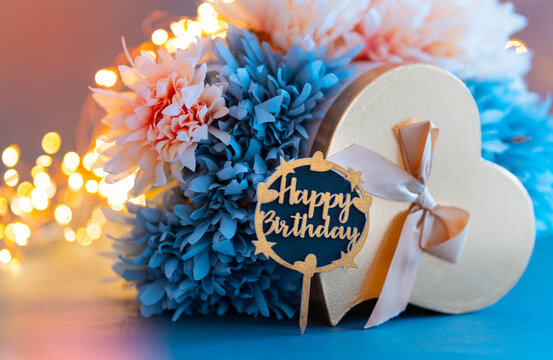 Colourful birthday gift background, Beautiful flowers with gift box and Happy birthday greeting text