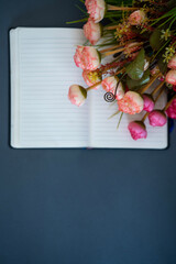 Notebook with beautiful flowers on the corner, Wedding anniversary, Birthday and valentines day greeting card concept background