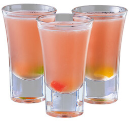 Three vodka shots with sweet jelly on black background
