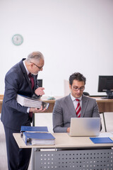 Two male colleagues working in the office