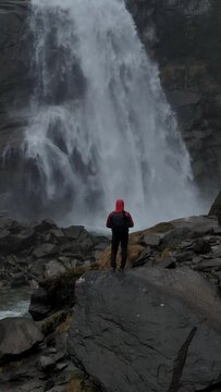 Waterfall with hiker in the mountains